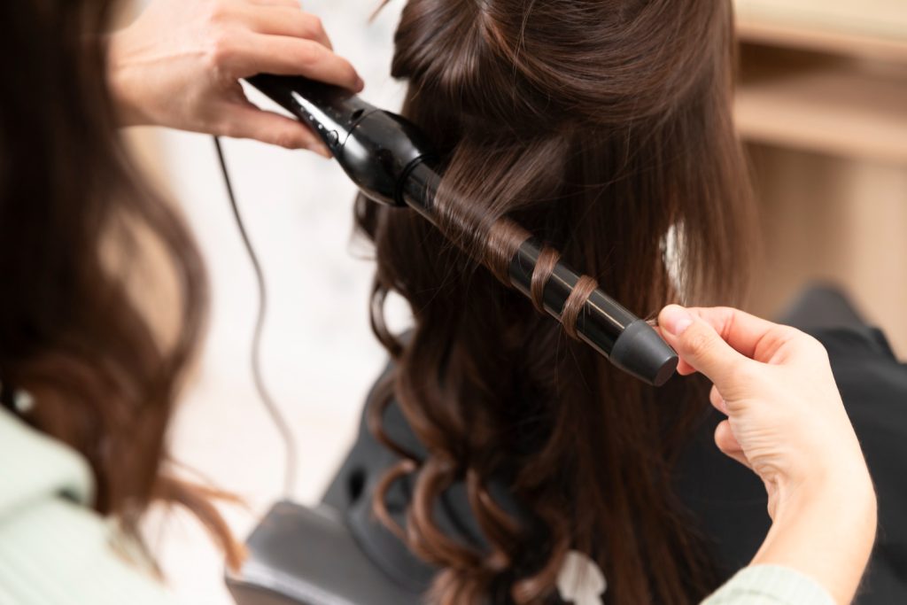 woman-getting-treatment-hairdresser-shop
